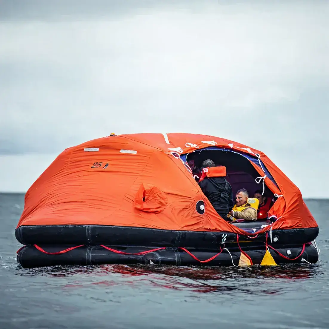 Inflatable life raft deployed at sea